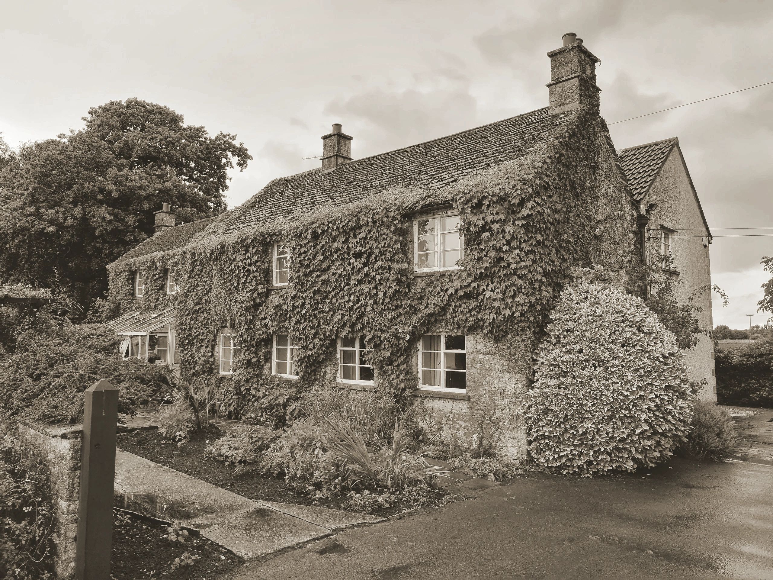 Ivy-covered stone cottage previously surveyed
